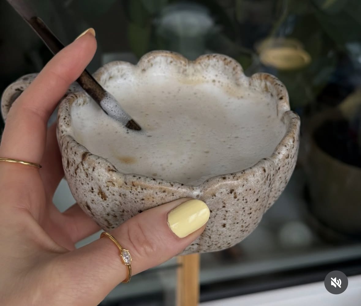 Scalloped flower bowl in hand
